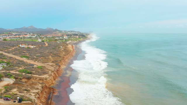 LA PLAYITA LOS CABOS MEXICO-2021: Coastal Cliff Path with Moving Cars and Ocean Waves