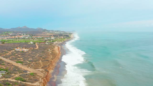 LA PLAYITA LOS CABOS MEXICO-2021: Cliffside Coast with Rolling Ocean Waves and Dunes