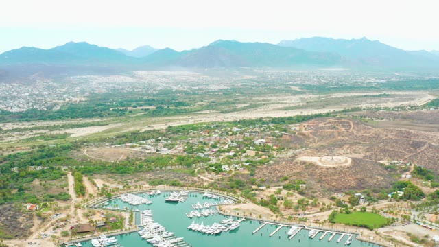 LA PLAYITA LOS CABOS MEXICO-2021: Marina and Airport Runway in Hilly Landscape