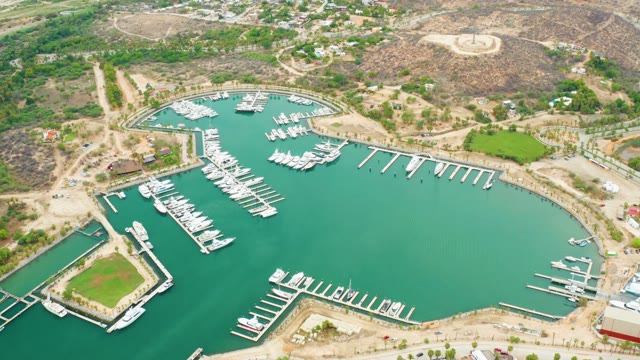 LA PLAYITA LOS CABOS MEXICO-2021: Marina with Docked Boats and Greening Hills
