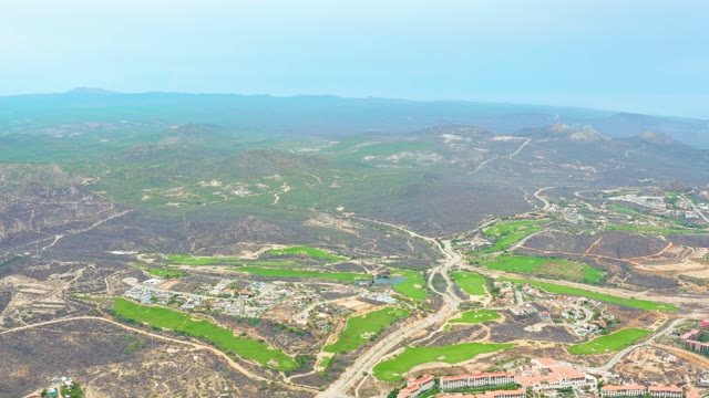 LA PLAYITA LOS CABOS MEXICO-2021: Valley with Green Fields and Mountainous Backdrop