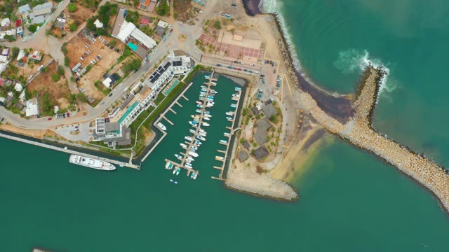 LA PLAYITA LOS CABOS MEXICO-2021: Marina with Departing Boat and Breaking Waves