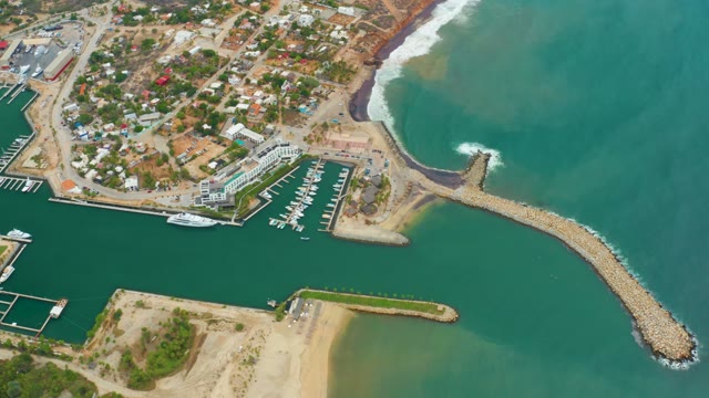LA PLAYITA LOS CABOS MEXICO-2021: Waves Crashing on Coastal Breakwater at Marina