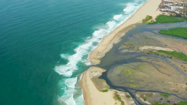 LA PLAYITA LOS CABOS MEXICO-2021: River Meeting Ocean at Sandy Shoreline