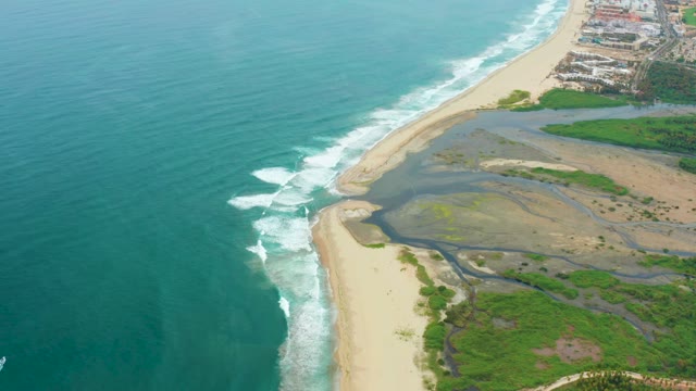 LA PLAYITA LOS CABOS MEXICO-2021: Ocean Waves on Sandy Beach with Coastal Estuary