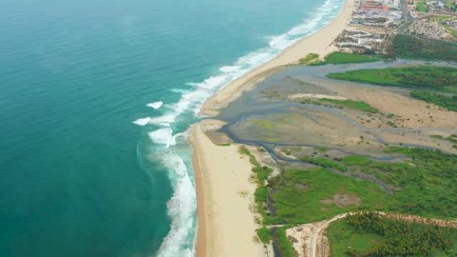 LA PLAYITA LOS CABOS MEXICO-2021: Ocean Waves and Lagoon Water Flow From Aerial View