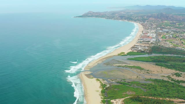 LA PLAYITA LOS CABOS MEXICO-2021: Coastal Town and Sandy Beach with Ocean Waves