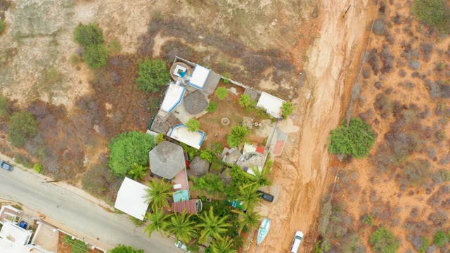 LA PLAYITA LOS CABOS MEXICO-2021: Rural Road with Moving Vehicles and Buildings
