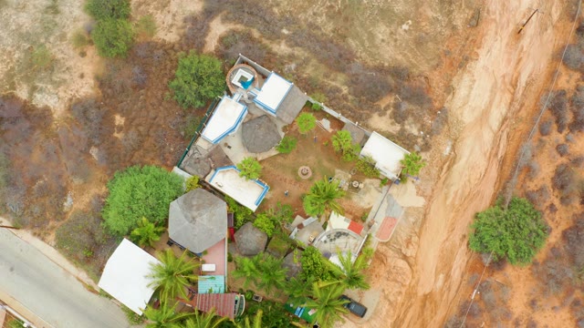 LA PLAYITA LOS CABOS MEXICO-2021: Car Moving on Road Near House Compound