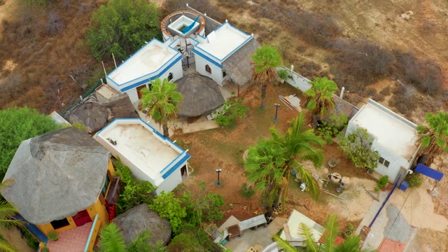 LA PLAYITA LOS CABOS MEXICO-2021: Thatched Huts and White Buildings in Arid Setting