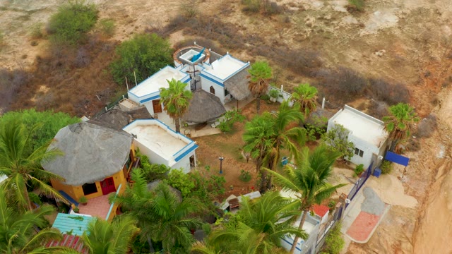 LA PLAYITA LOS CABOS MEXICO-2021: Desert Homestead with Thatched Roofs and Palm Trees