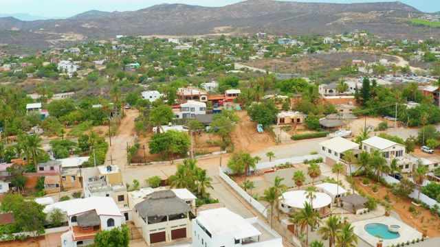 LA PLAYITA LOS CABOS MEXICO-2021: Panning Aerial of Suburban Homes in Mountainous Area