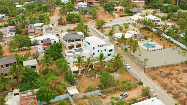 LA PLAYITA LOS CABOS MEXICO-2021: Residential Area Building Construction and Road Traffic
