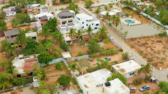 LA PLAYITA LOS CABOS MEXICO-2021: Residential Neighborhood with Moving Vehicles and Roof Work