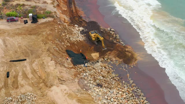 LA PLAYITA LOS CABOS MEXICO-2021: Coastal Construction with Excavator Moving Earth