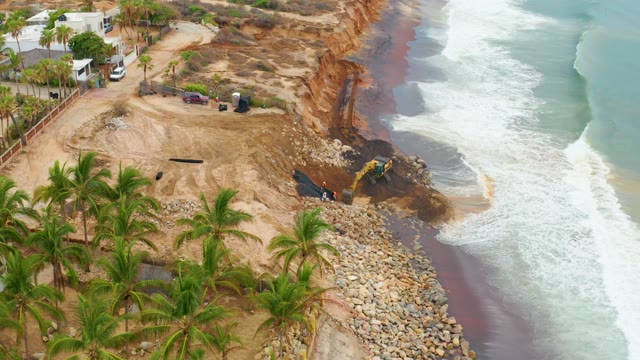 LA PLAYITA LOS CABOS MEXICO-2021: Coastal Erosion and Excavator Work at Cliff Edge