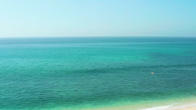 EL TULE BEACH LOS CABOS BCS MEXICO-2021: Gentle Ocean Waves and Sandy Beach with Umbrella