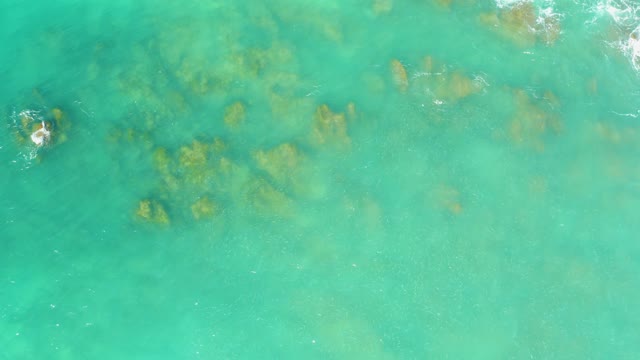 EL TULE BEACH LOS CABOS BCS MEXICO-2021: Clear Turquoise Ocean Water with Submerged Rocks