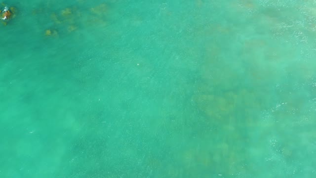 EL TULE BEACH LOS CABOS BCS MEXICO-2021: Swimmer in Clear Turquoise Ocean Water