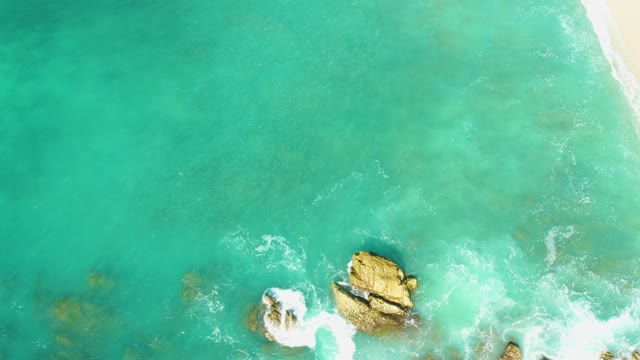 EL TULE BEACH LOS CABOS BCS MEXICO-2021: Waves Crashing on Rocky Shore From Above