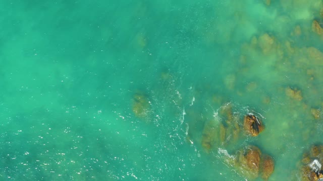 EL TULE BEACH LOS CABOS BCS MEXICO-2021: Turquoise Water Lapping Over Submerged Rocks