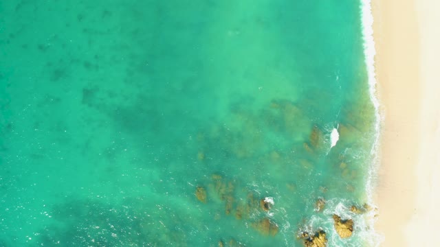 EL TULE BEACH LOS CABOS BCS MEXICO-2021: Gentle Waves Lapping Rocky Shore From Above