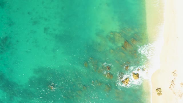 EL TULE BEACH LOS CABOS BCS MEXICO-2021: Waves Ebbing and Flowing on Sandy Shoreline