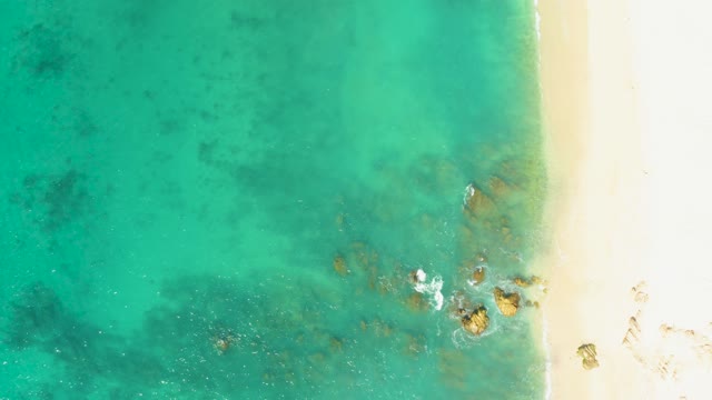 EL TULE BEACH LOS CABOS BCS MEXICO-2021: Waves Rolling Onto Sandy Shore From Above