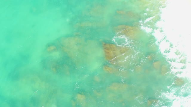 EL TULE BEACH LOS CABOS BCS MEXICO-2021: Gentle Waves Lapping Against Rocky Shoreline
