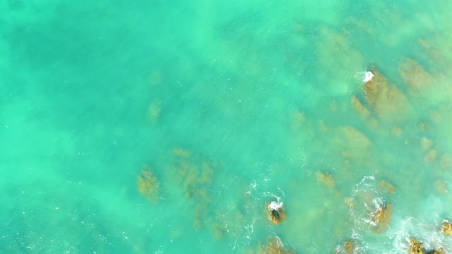 EL TULE BEACH LOS CABOS BCS MEXICO-2021: Swimmer Moving Through Clear Turquoise Shallow Water