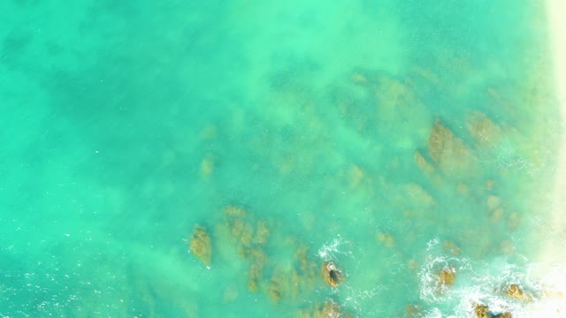 EL TULE BEACH LOS CABOS BCS MEXICO-2021: Gentle Waves Over Rocky Seabed in Clear Turquoise Water