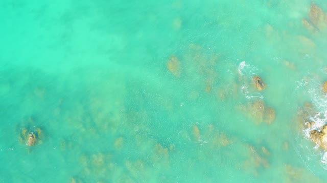 EL TULE BEACH LOS CABOS BCS MEXICO-2021: Clear Turquoise Ocean with Underwater Rocks and Gentle Waves