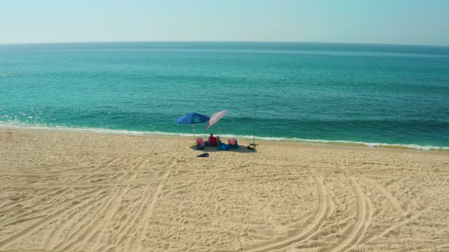 EL TULE BEACH LOS CABOS BCS MEXICO-2021: Beach Umbrella and Gentle Ocean Waves