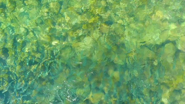 EL TULE BEACH LOS CABOS BCS MEXICO-2021: Clear Shallow Water with Sunlight Refracting on Rocks