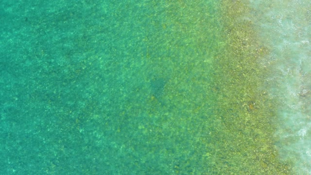 EL TULE BEACH LOS CABOS BCS MEXICO-2021: Gentle Ocean Waves Over Shallow Sandy Seabed