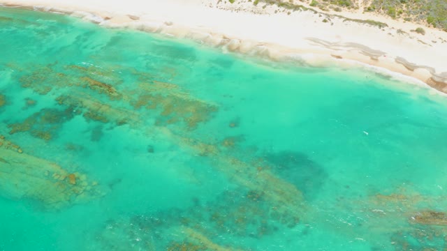 CABO PULMO LOS CABOS BCS MEXICO-2021: Turquoise Waters Lapping a Sandy Shore with Submerged Rocks