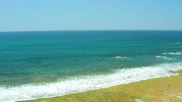 EL TULE BEACH LOS CABOS BCS MEXICO-2021: Waves Rolling Onto a Sandy Beach