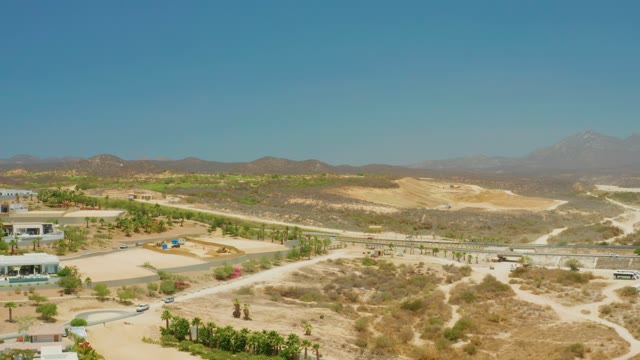 EL TULE BEACH LOS CABOS BCS MEXICO-2021: Desert Roads with Moving Vehicles and Distant Mountains