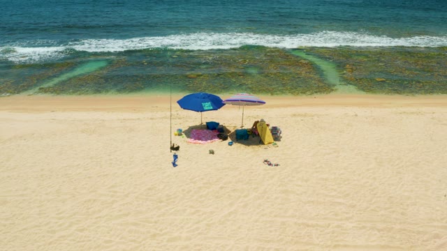 EL TULE BEACH LOS CABOS BCS MEXICO-2021: Beach with Umbrellas and Ocean Waves From Above