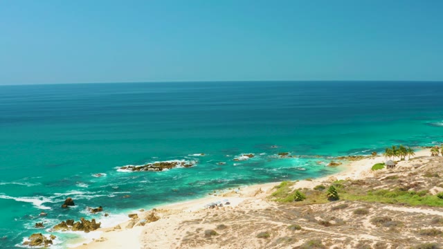 DREAMS LOS CABOS BCS MEXICO-2021: Waves Rolling Onto Sandy Beach From Dune