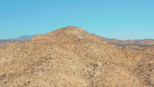 DREAMS LOS CABOS BCS MEXICO-2021: Desert Hills with Sparse Vegetation Under Clear Sky