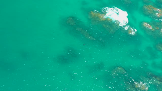 DREAMS LOS CABOS BCS MEXICO-2021: Gentle Waves Breaking Over Rocky Ocean Floor