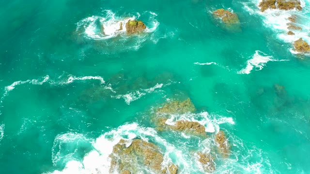DREAMS LOS CABOS BCS MEXICO-2021: Turquoise Ocean Waves Crashing on Rocky Outcrops