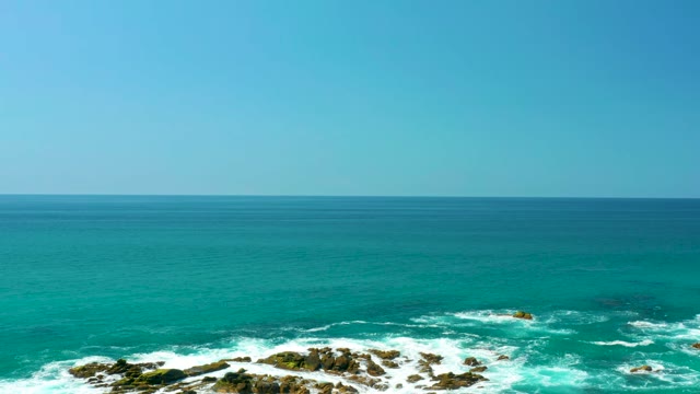 DREAMS LOS CABOS BCS MEXICO-2021: Waves Crashing Against Rocky Shoreline