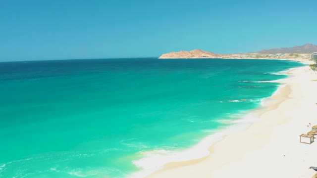 DREAMS LOS CABOS BCS MEXICO-2021: Gentle Ocean Waves Lapping at Sandy Shore