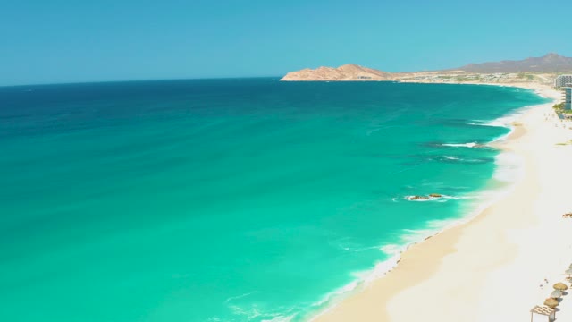 DREAMS LOS CABOS BCS MEXICO-2021: Gentle Ocean Waves Lapping at Sandy Shore
