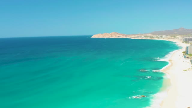 DREAMS LOS CABOS BCS MEXICO-2021: Waves Moving Along Sandy Beach Coastline