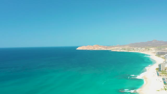 DREAMS LOS CABOS BCS MEXICO-2021: Gentle Waves Lapping Sandy Beach with Clear Blue Water