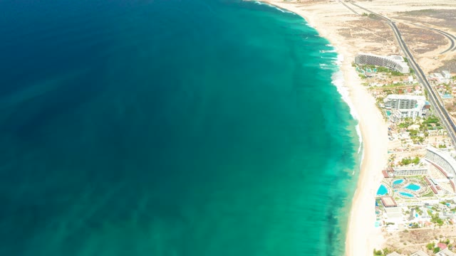 DREAMS LOS CABOS BCS MEXICO-2021: Sandy Beach and Turquoise Ocean with Resort Buildings
