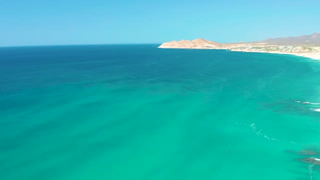 DREAMS LOS CABOS BCS MEXICO-2021: Turquoise Ocean Waves Lapping Sandy Coast